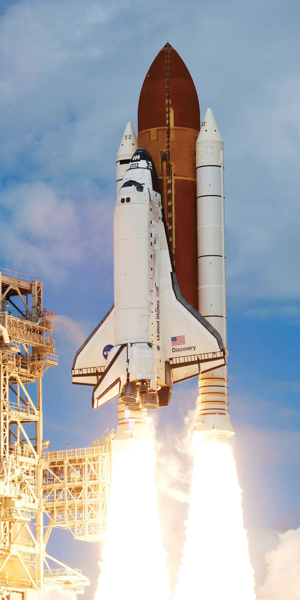 The Space Shuttle lifts off.